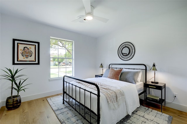 bedroom with ceiling fan and light wood-type flooring