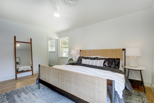 bedroom featuring ceiling fan and wood-type flooring