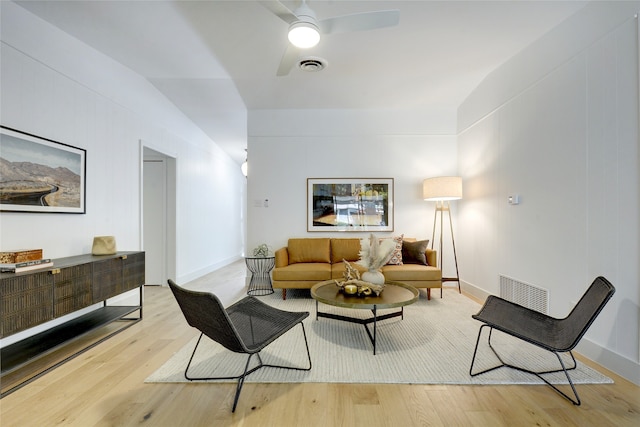 living room featuring light wood-type flooring and ceiling fan