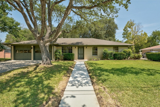 single story home with a front yard and a garage