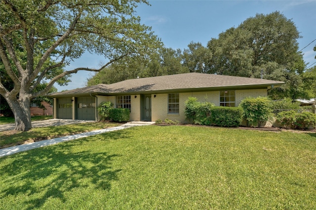 ranch-style house with a garage and a front yard