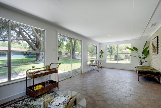 sunroom / solarium featuring a wealth of natural light