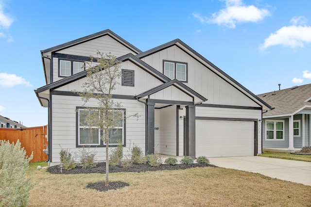 view of front of home featuring a front lawn and a garage