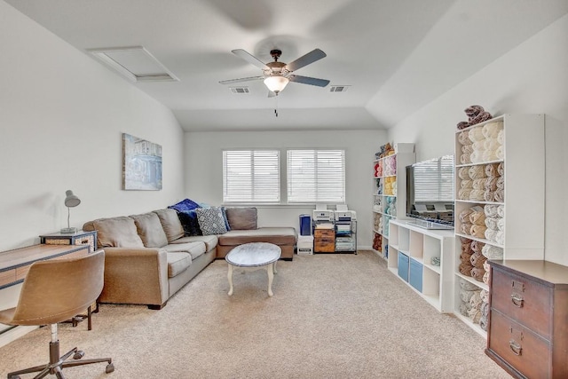 carpeted living room featuring vaulted ceiling and ceiling fan