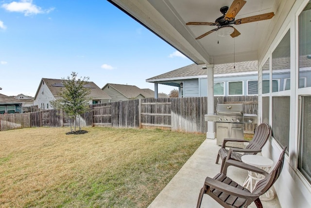 view of yard featuring ceiling fan