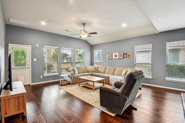 living room with lofted ceiling, ceiling fan, and dark wood-type flooring