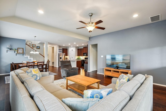 living room with vaulted ceiling, ceiling fan, dark wood-type flooring, and sink