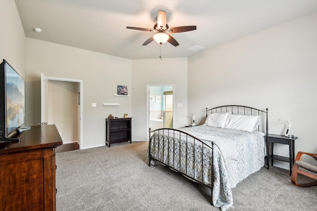 bedroom featuring carpet, ensuite bathroom, and ceiling fan