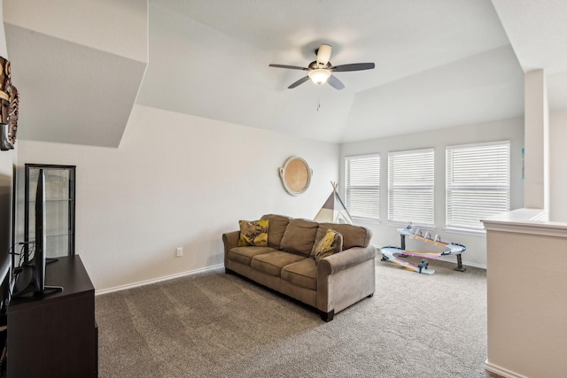 carpeted living room featuring ceiling fan and vaulted ceiling