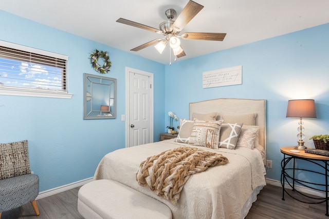 bedroom featuring hardwood / wood-style flooring and ceiling fan