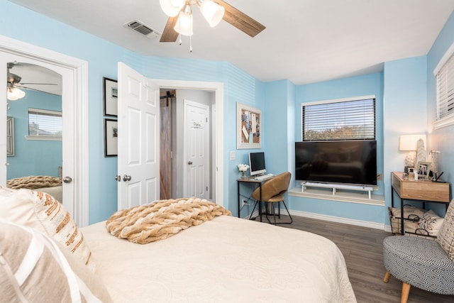 bedroom featuring multiple windows, ceiling fan, and dark wood-type flooring