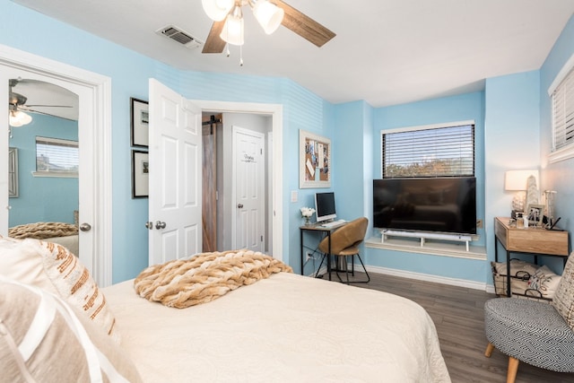 509 Short Circuit Unit 203, Horseshoe Bay, TX 78657 - bedroom featuring wood finished floors, multiple windows, and ceiling fan