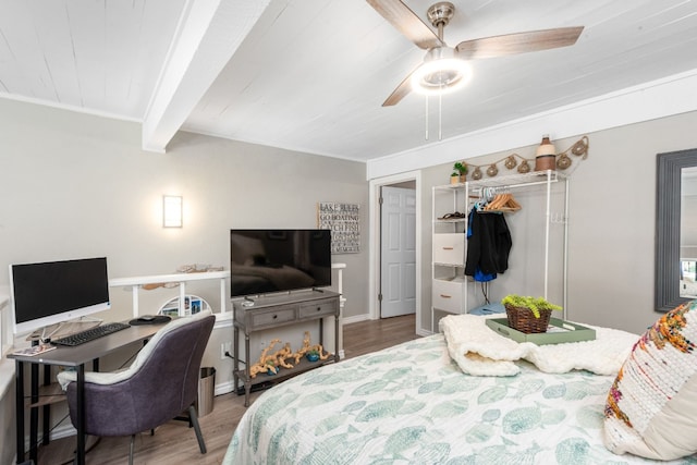 509 Short Circuit Unit 203, Horseshoe Bay, TX 78657 - bedroom with an office area, wood finished floors, a closet, a ceiling fan, and a wood ceiling with exposed beams