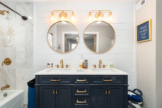 bathroom with shower / bathing tub combination and vanity