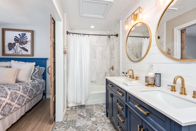 bathroom with shower / bath combo, vanity, and wood-type flooring