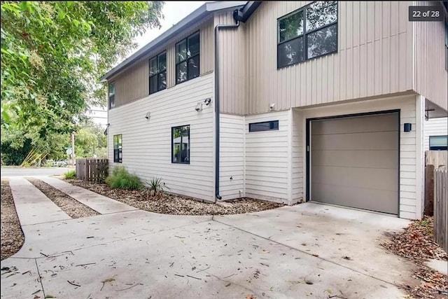 view of side of home featuring a garage