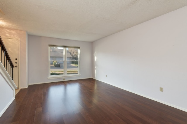 8233 Summer Side Dr Unit 172, Austin, TX 78759 - unfurnished room with wood finished floors, stairs, and a textured ceiling