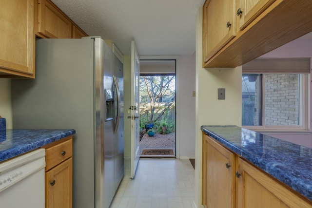 8233 Summer Side Dr Unit 172, Austin, TX 78759 - kitchen with stainless steel refrigerator with ice dispenser, white dishwasher, dark countertops, and light floors