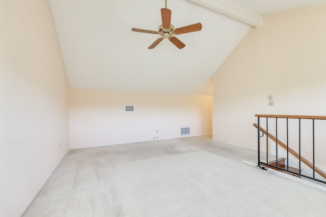 carpeted spare room with beam ceiling, ceiling fan, and high vaulted ceiling