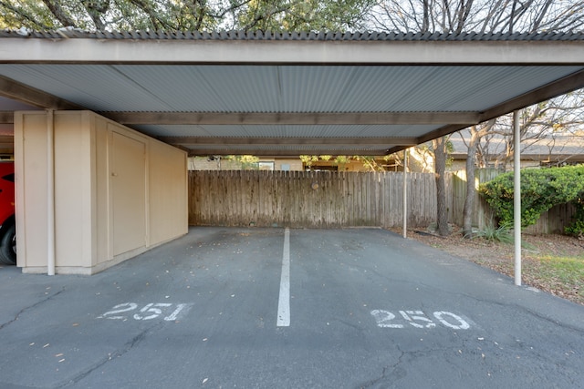 view of vehicle parking with a carport