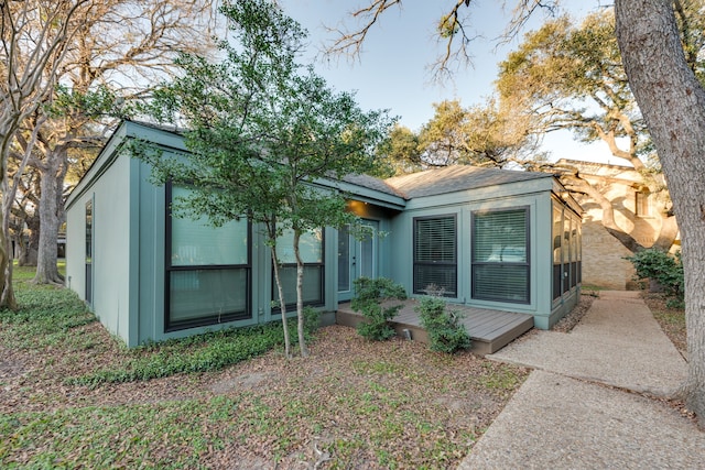 rear view of property with a deck