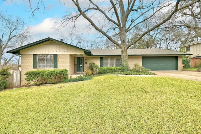 ranch-style home with a front lawn and a garage