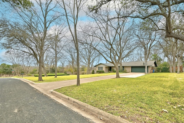 view of front facade with a garage and a front yard