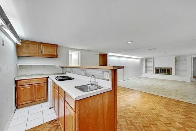 4204 Gregg Ward Ln, Austin, TX 78744 - kitchen with built in features, light countertops, open floor plan, and brown cabinets