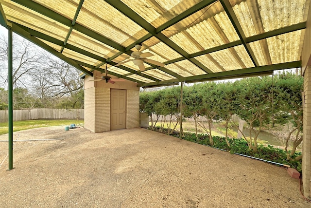 exterior space with a pergola and ceiling fan