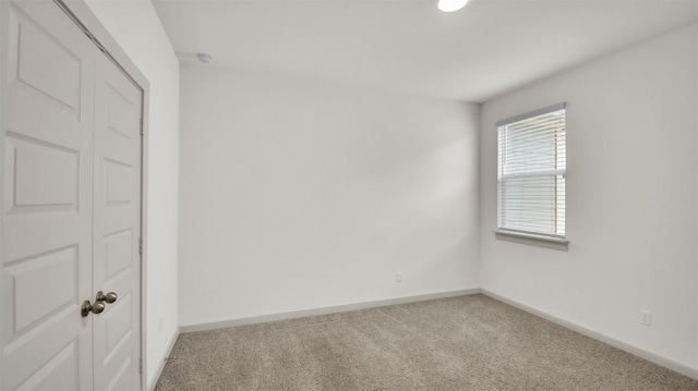 empty room with carpet flooring