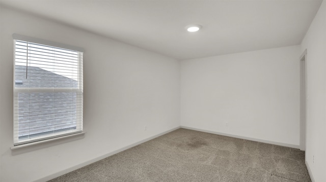 empty room with carpet flooring