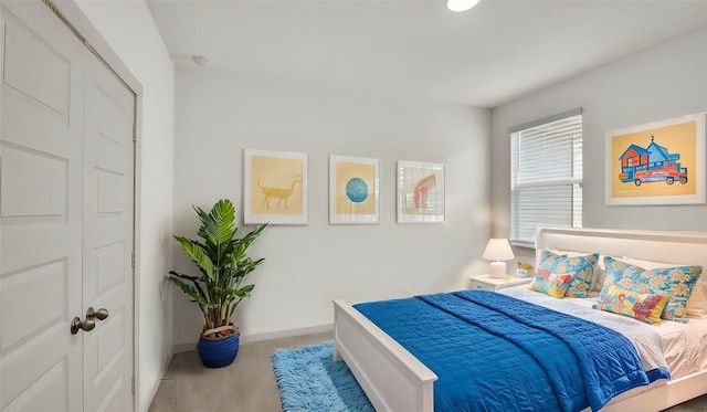 carpeted bedroom featuring a closet