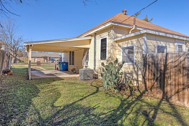 view of home's exterior with central air condition unit, a patio area, and a yard