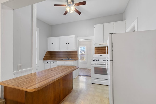 kitchen with ceiling fan, sink, white appliances, decorative backsplash, and white cabinets