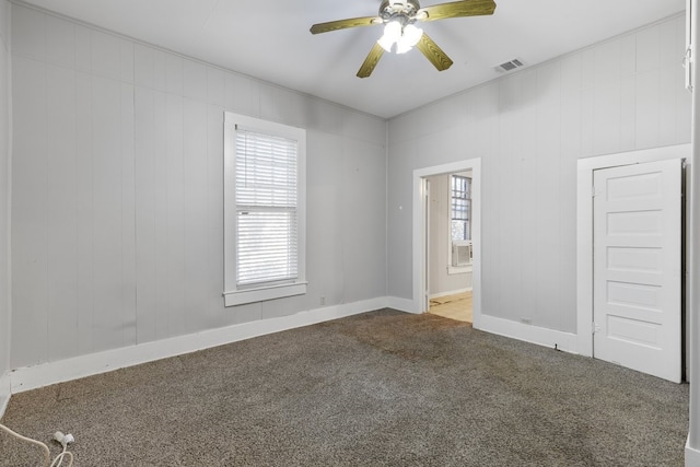 unfurnished room with ceiling fan and carpet floors