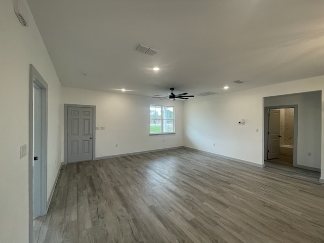 unfurnished room with ceiling fan and light hardwood / wood-style floors