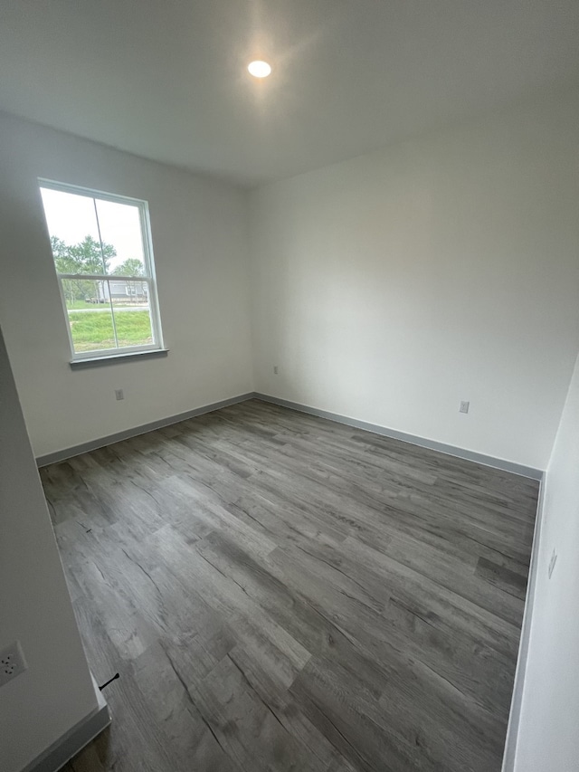 unfurnished room featuring wood-type flooring