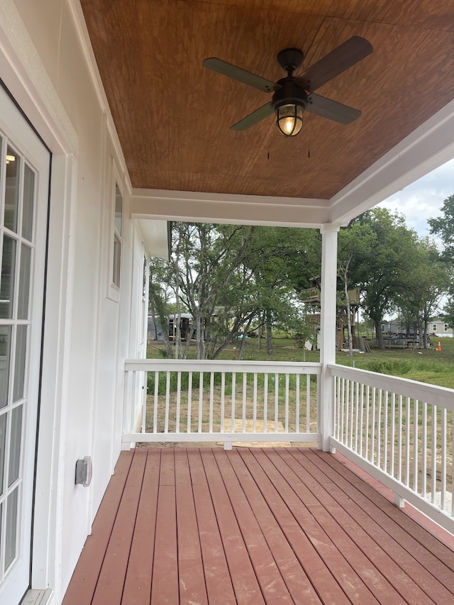 wooden terrace featuring ceiling fan