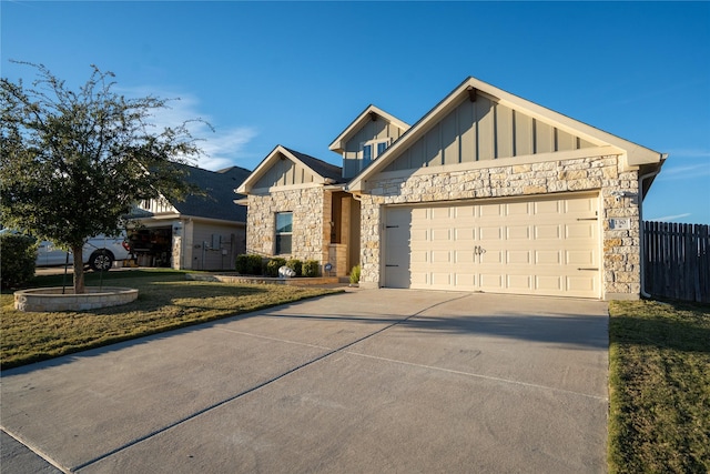 view of front of home with a front yard and a garage