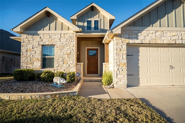 doorway to property with a garage