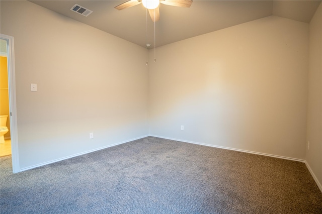 carpeted empty room with vaulted ceiling and ceiling fan