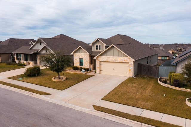 craftsman-style home featuring a front yard and a garage