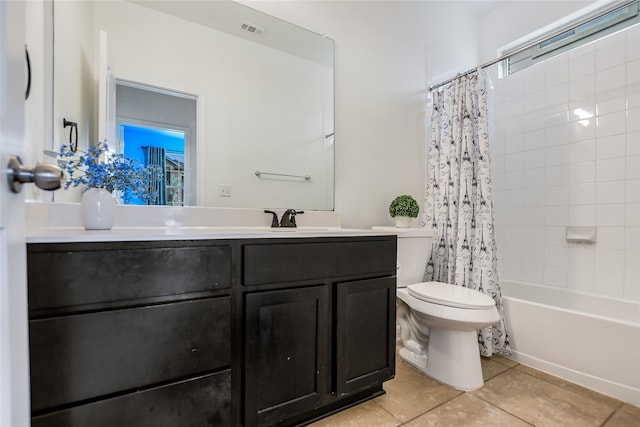 full bathroom featuring vanity, toilet, tile patterned floors, and shower / bathtub combination with curtain