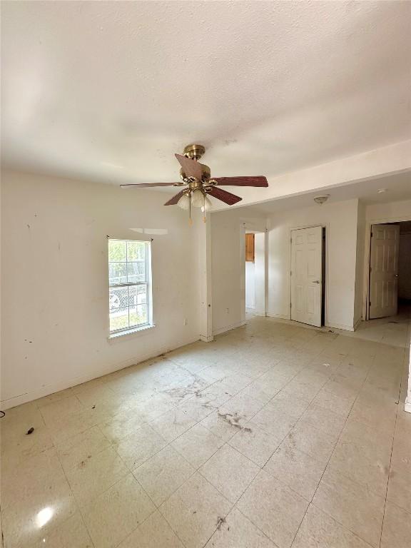 820 Chihuahua St, Lockhart, TX 78644 - empty room with ceiling fan