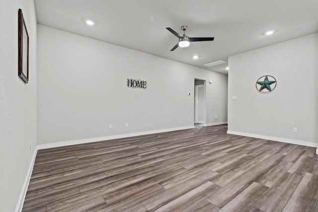 empty room featuring hardwood / wood-style flooring and ceiling fan