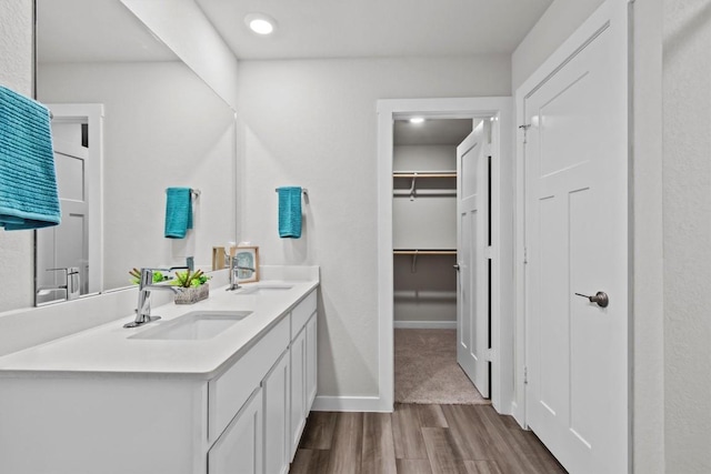 bathroom with vanity and hardwood / wood-style flooring