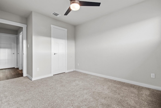 unfurnished bedroom featuring ceiling fan, carpet floors, and a closet