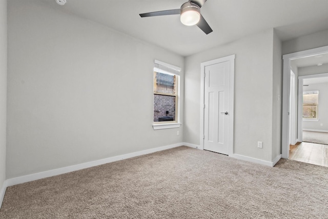 unfurnished bedroom featuring carpet and ceiling fan