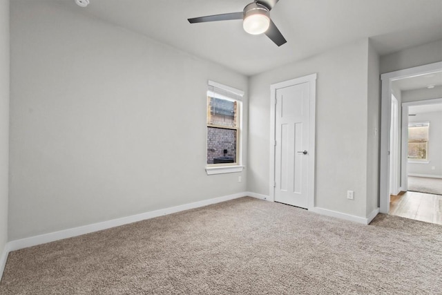 unfurnished bedroom with carpet floors and ceiling fan