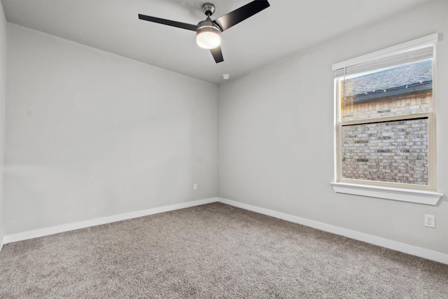 unfurnished room with carpet flooring and ceiling fan